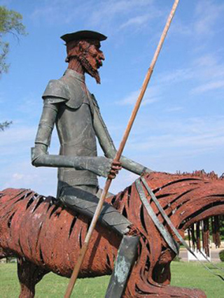 A photo of a statue of the character Don Quixote. A photo of a statue of the character Don Quixote.