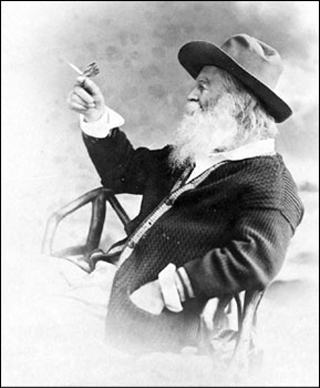 Photo of Walt Whitman holding butterfly. Photo of Walt Whitman holding butterfly.