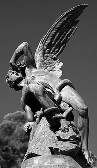Black and white photo of the statue of an angel, having just fallen from the sky. Black and white photo of the statue of an angel, having just fallen from the sky.