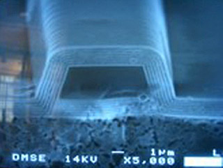 Microscope photo of end view of a multi-layered waveguide. Microscope photo of end view of a multi-layered waveguide.