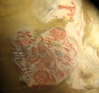 Cave painting with intricate geometric patterns. Cave painting with intricate geometric patterns.