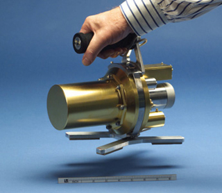 Photo of a metal, hand-held radiation detector. Photo of a metal, hand-held radiation detector.