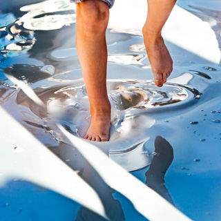A pair of feet walking on fluid. A pair of feet walking on fluid.