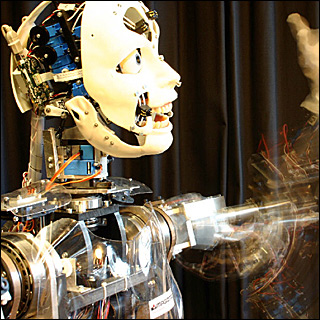 A humanoid robot moving waving its left arm. A humanoid robot moving waving its left arm.