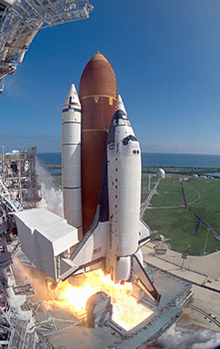 Photo of space shuttle launch. Photo of space shuttle launch.
