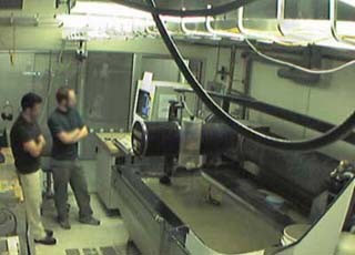 Photo of the MIT Media Lab waterjet cutter at work. Photo of the MIT Media Lab waterjet cutter at work.