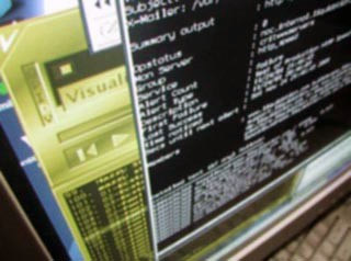 A photo of a computer screen with several overlapping application windows open, each displaying text. A photo of a computer screen with several overlapping application windows open, each displaying text.