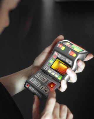 A woman gazes at her tricorder, decoding the various signs and signals of life. A woman gazes at her tricorder, decoding the various signs and signals of life.