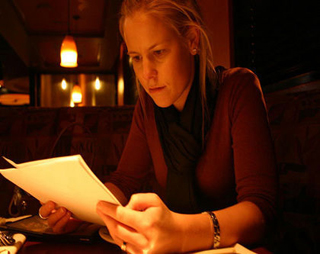Photograph of a woman reading a script. Photograph of a woman reading a script.