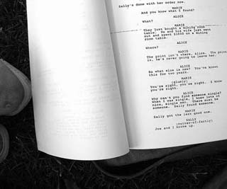 Photograph of a page from a theatrical script. Photograph of a page from a theatrical script.