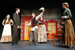 A photo of five perfomers on stage. A photo of five perfomers on stage.