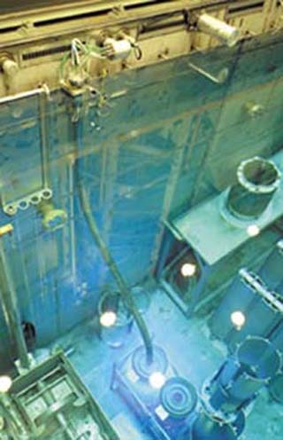 A photograph looking dow into the High Flux Isotope Reactor at Oak Ridge National Laboratory. A photograph looking dow into the High Flux Isotope Reactor at Oak Ridge National Laboratory.