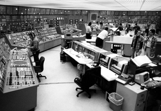 Photo of large control room, showing many screens and devices. Photo of large control room, showing many screens and devices.