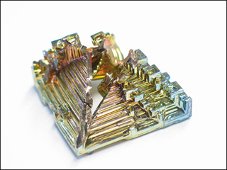 An irridescent synthetic bismuth crystal. An irridescent synthetic bismuth crystal.