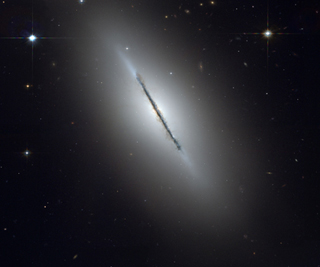 A galaxy, seen from the side. A galaxy, seen from the side.