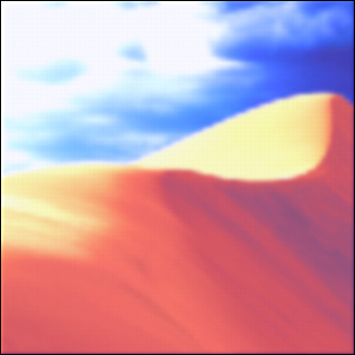 A blurry image of a sand dune and sky above. A blurry image of a sand dune and sky above.