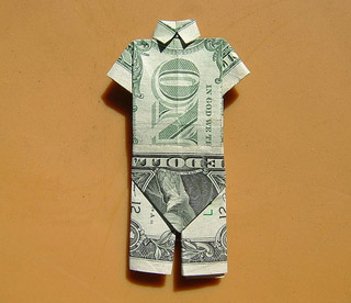 Origami: dollar bills folded up in the shape of full suit. Origami: dollar bills folded up in the shape of full suit.
