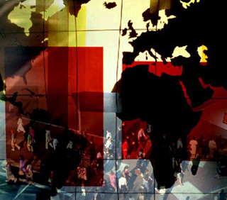 A world map superimposed over a crowd of people. A world map superimposed over a crowd of people.