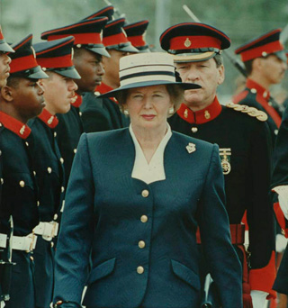 A woman walks past a row of officers. A woman walks past a row of officers.