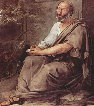 A balding, middle-aged man wearing a tunic and sandals, sits against a monument with a pen in his hand. A balding, middle-aged man wearing a tunic and sandals, sits against a monument with a pen in his hand.
