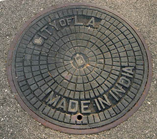 Manhole cover that reads City of L.A. in the upper half, Made in India in the lower half. Manhole cover that reads City of L.A. in the upper half, Made in India in the lower half.
