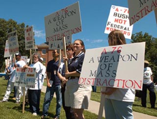 A photo of protestors with signs. A photo of protestors with signs.