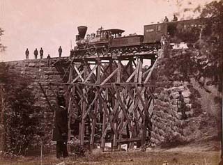 Photograph of locomotive on a railroad bridge, from 1865. Photograph of locomotive on a railroad bridge, from 1865.