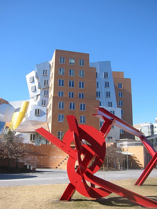 A photograph of the Stata Center at MIT, with a red sculpture in the foreground. A photograph of the Stata Center at MIT, with a red sculpture in the foreground.