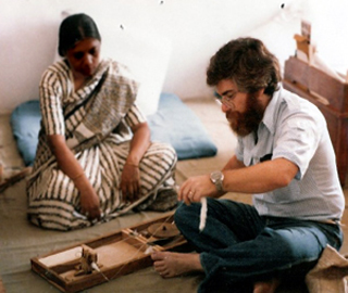 Michael Fischer learns to use a Gandhian spinning wheel of self-reliance. Michael Fischer learns to use a Gandhian spinning wheel of self-reliance.