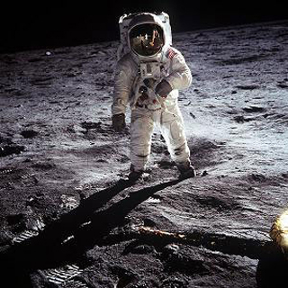 Photo of an astronaut on the surface of the moon. Photo of an astronaut on the surface of the moon.