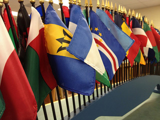 A number of standing flags arranged in a row. A number of standing flags arranged in a row.