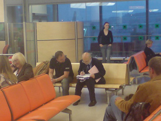 Photograph of people answering survey questions. Photograph of people answering survey questions.