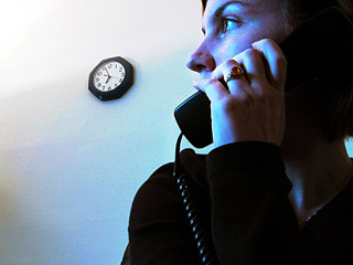 Young woman on telephone. Young woman on telephone.