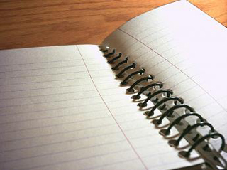An open, spiral-bound notebook. An open, spiral-bound notebook.