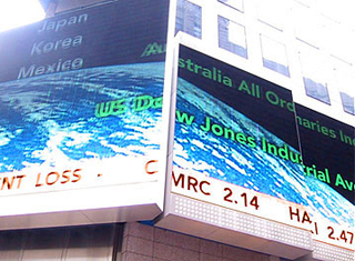 Phot of a billboard displaying a stock ticker. Phot of a billboard displaying a stock ticker.