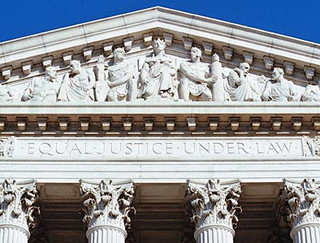 A photo of the top of the U.S. Supreme Court building. A photo of the top of the U.S. Supreme Court building.