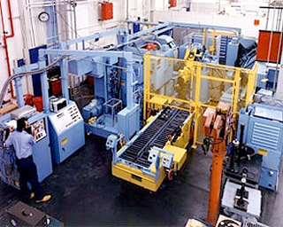 Several large machines in a manufacturing plant. Several large machines in a manufacturing plant.