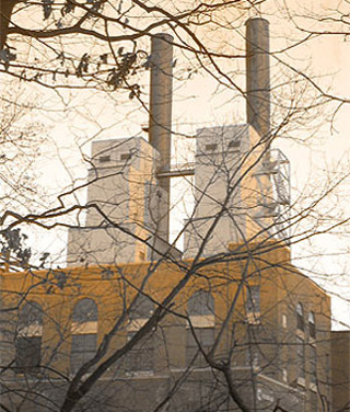 Outside of a factory building with smokestacks. Outside of a factory building with smokestacks.
