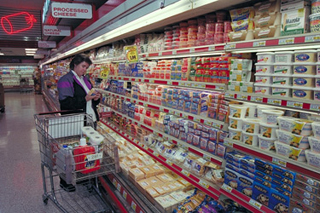 A photograph of a woman shopping in a Giant Supermarket. A photograph of a woman shopping in a Giant Supermarket.