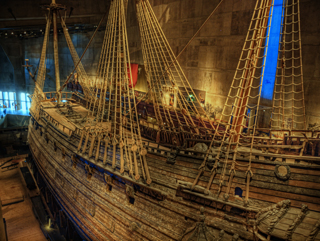 Photo of starboard side of the Swedish warship Vasa with carved statue detail. Photo of starboard side of the Swedish warship Vasa with carved statue detail.