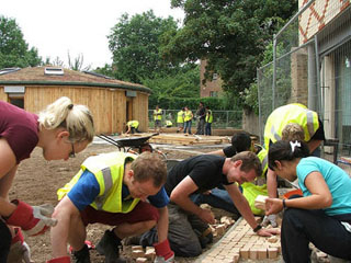 Volunteers working on a construction project. Volunteers working on a construction project.