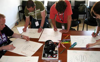 Photograph of group problem-solving. Photograph of group problem-solving.