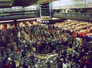Photograph of a busy trading floor. Photograph of a busy trading floor.