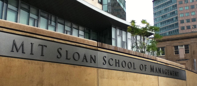 A photo of a sign reading "MIT Sloan School of Management". A photo of a sign reading "MIT Sloan School of Management".