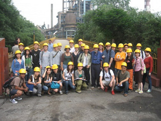Photograph of studio participants touring the steel factory site. Photograph of studio participants touring the steel factory site.