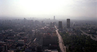 An aerial photo of Mexico City, partially obscured by smog. An aerial photo of Mexico City, partially obscured by smog.