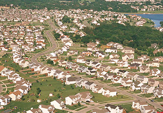 Suburban community filled with new houses. Suburban community filled with new houses.
