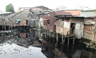 A photograph of dilapidated homes. A photograph of dilapidated homes.