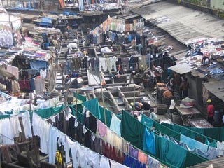 Photo showing a crowded area with laundry hanging throughout. Photo showing a crowded area with laundry hanging throughout.