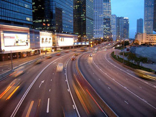 Photograph of a city and highway at night. Photograph of a city and highway at night.